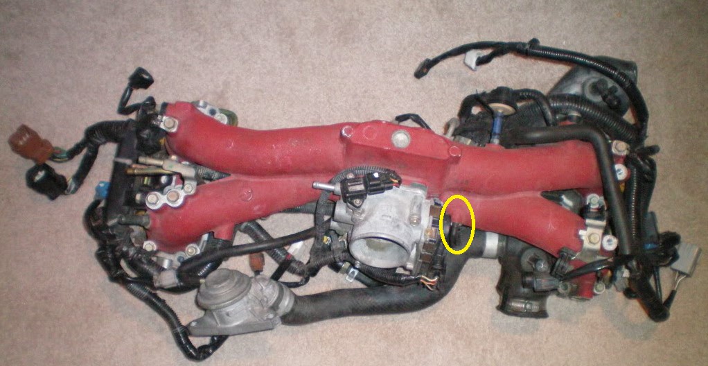 2005 STI Intake Manifold, FPR Reference Nipple circled in yellow.